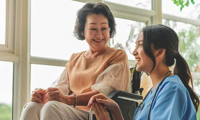 Healthcare professional providing personalized care to elderly patient