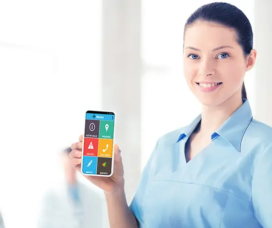 Healthcare professional using nurse call communication device